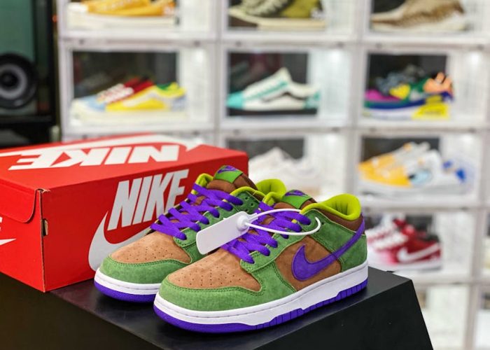 pexels-photo-5584504-5584504 Colorful sneakers with Nike logo displayed in a stylish shoe store with a blurred background.